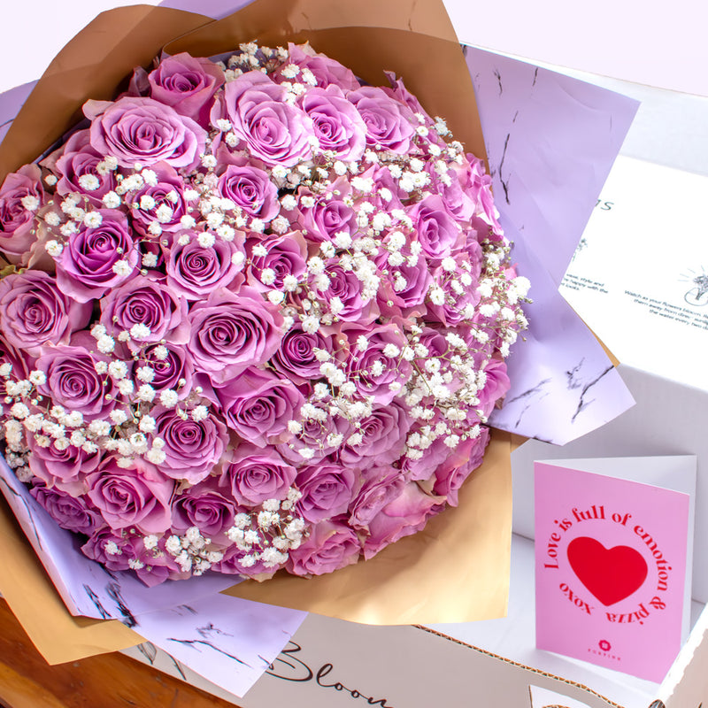 The Purple Roses & White Baby Breath Bouquet